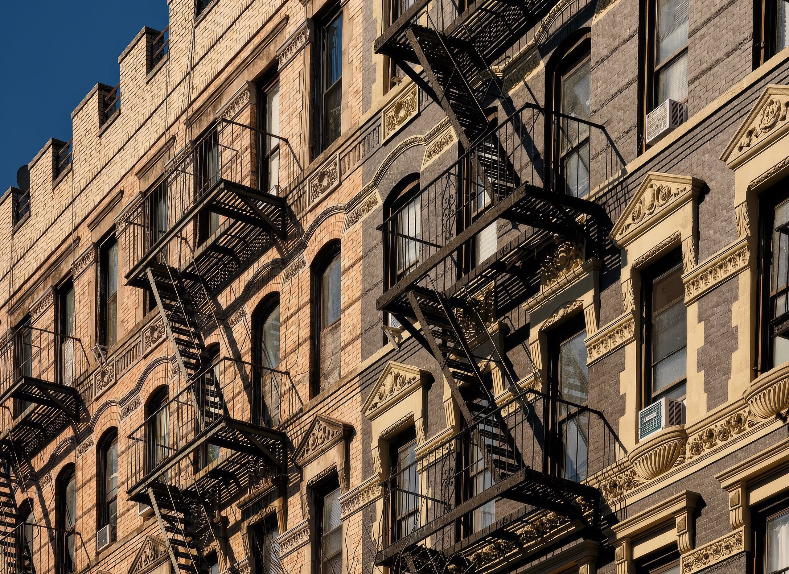 A building with a fire escape on the side.